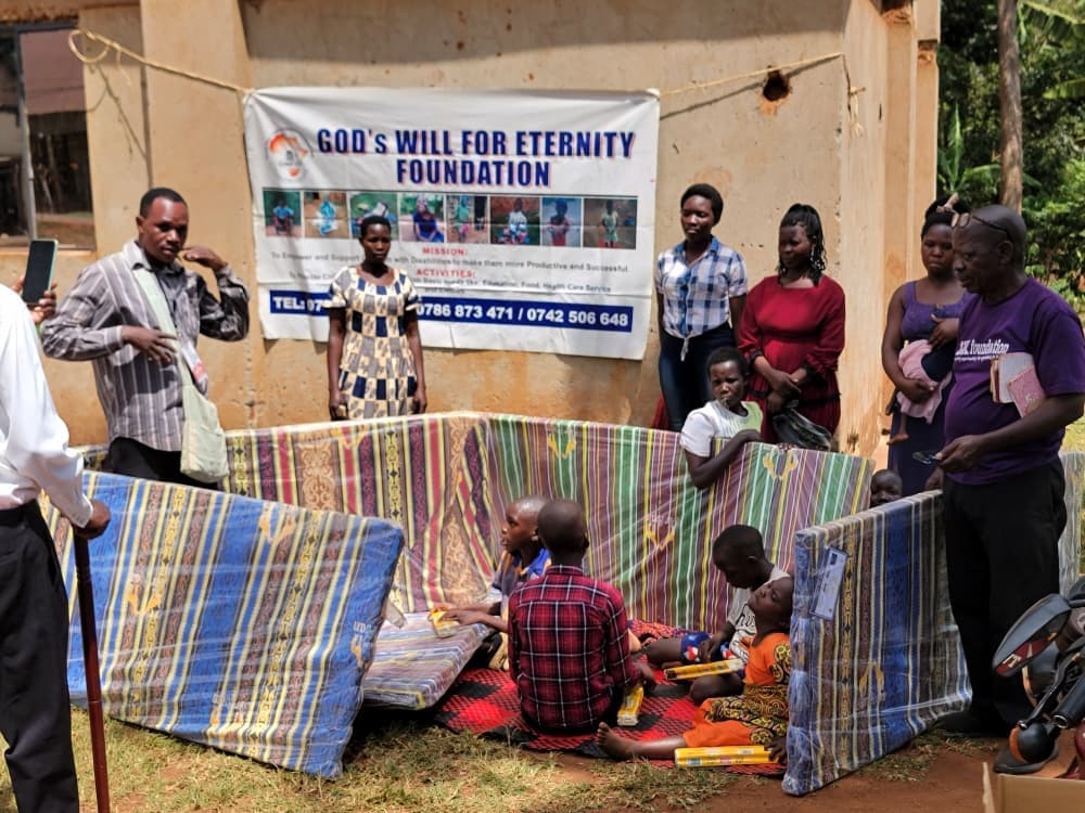 Children in a classroom raising their hands.